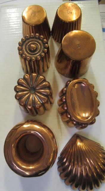 FIFTEEN SMALL VICTORIAN COPPER JELLY MOULDS including a shell Image