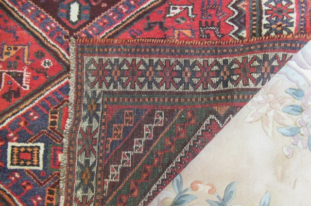 A PERSIAN TRIBAL RUG Image