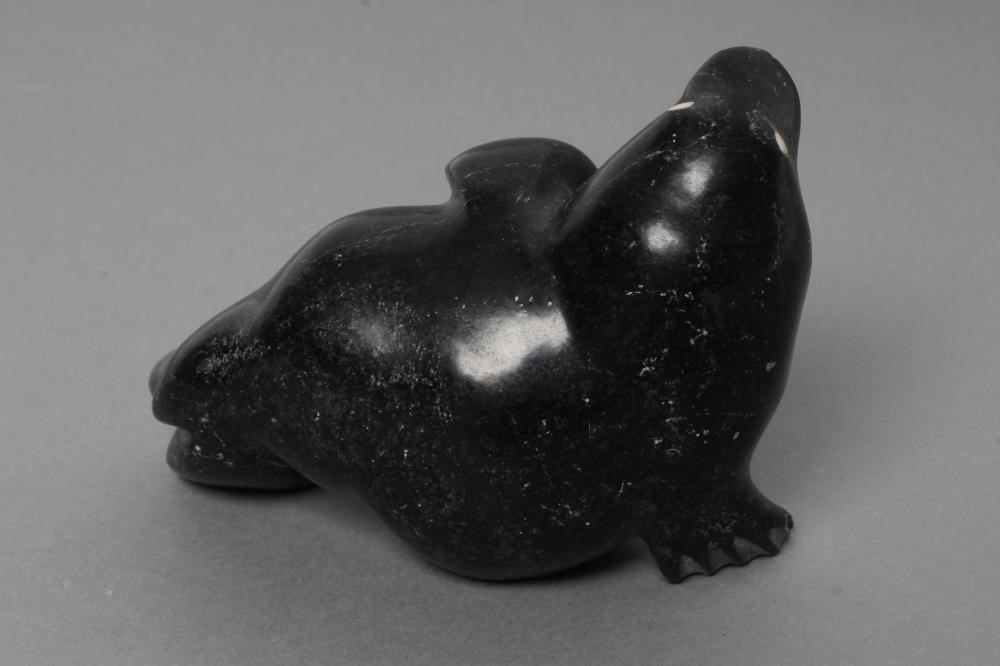 THREE INUIT STONE CARVINGS depicting a seal Image