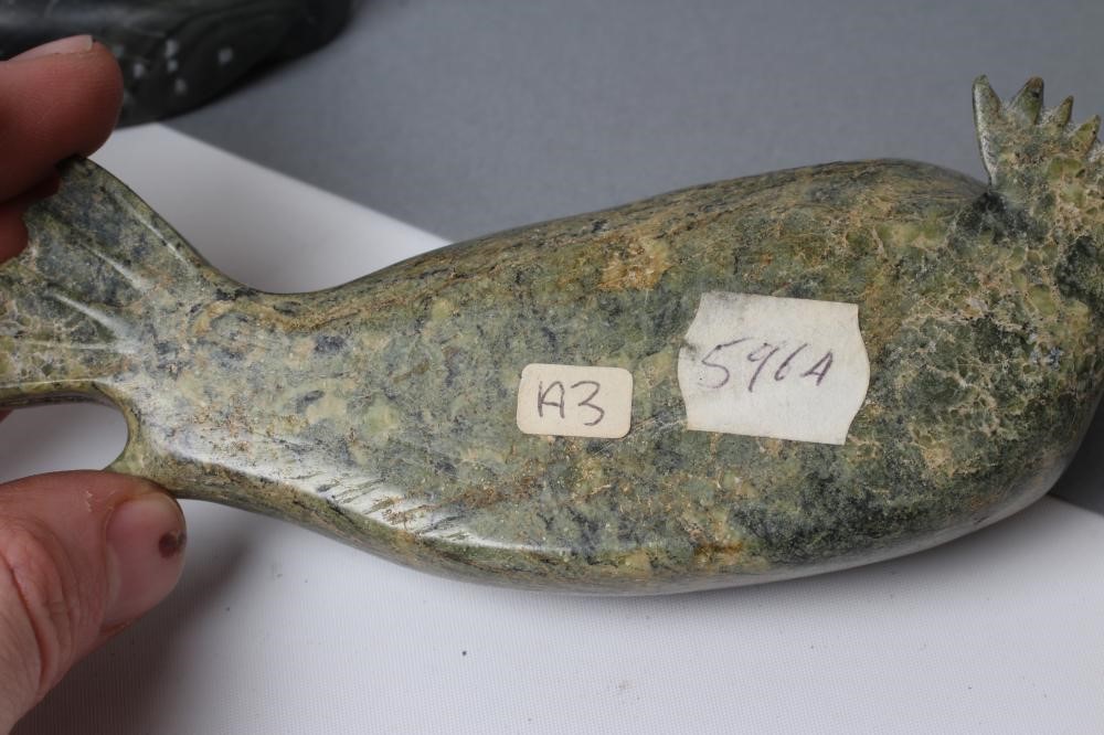 THREE INUIT STONE CARVINGS depicting a seal Image