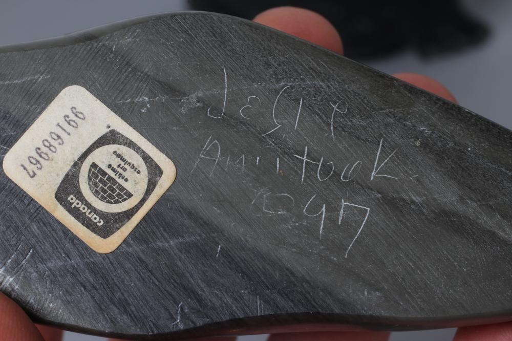 THREE INUIT STONE CARVINGS depicting a seal Image