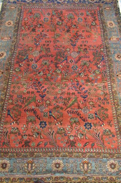 AN ANTIQUE PERSIAN RUG Image