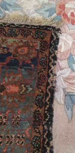 AN ANTIQUE PERSIAN RUG Image