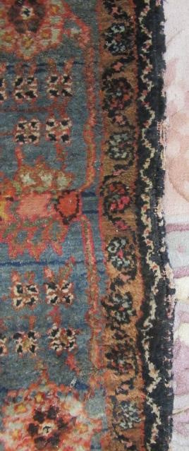 AN ANTIQUE PERSIAN RUG Image