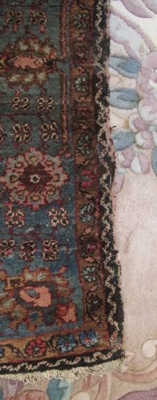 AN ANTIQUE PERSIAN RUG Image