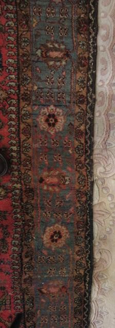 AN ANTIQUE PERSIAN RUG Image
