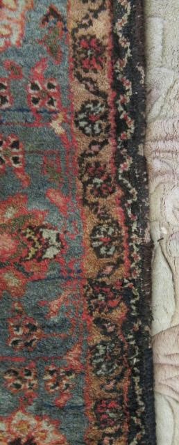 AN ANTIQUE PERSIAN RUG Image