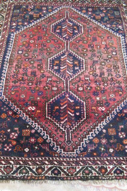 A PERSIAN TRIBAL RUG Image