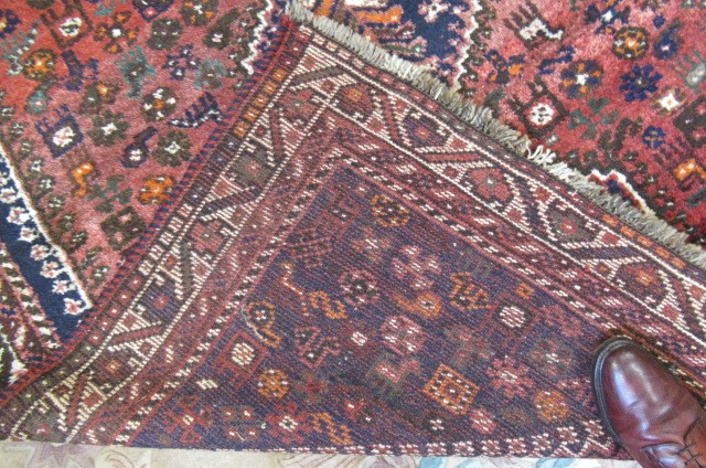 A PERSIAN TRIBAL RUG Image
