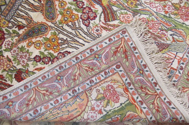A SMALL PERSIAN SILK RUG Image