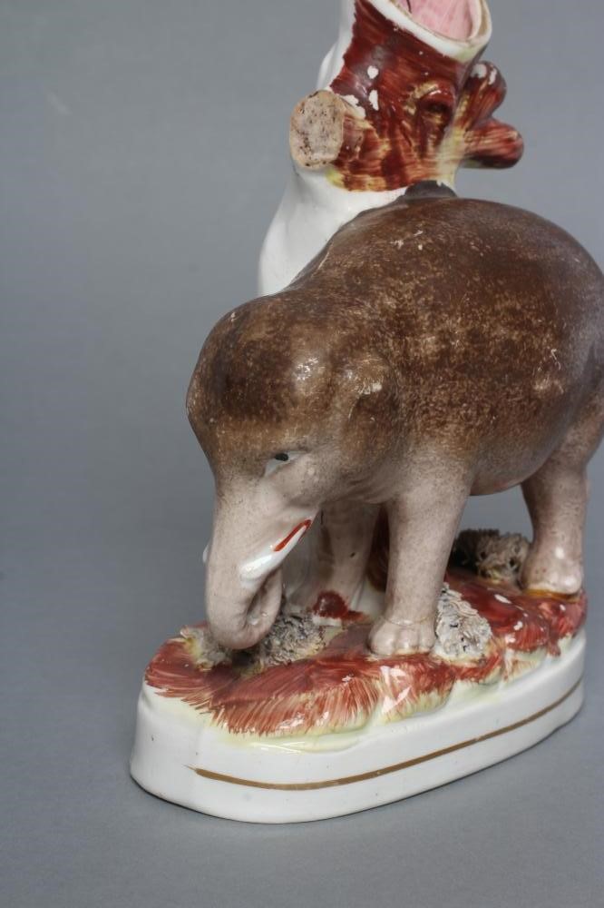 A VICTORIAN STAFFORDSHIRE POTTERY ELEPHANT SPILL VASE modelled standing with two free legs Image