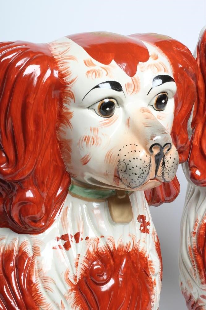 AN UNUSUALLY LARGE PAIR OF STAFFORDSHIRE STYLE POTTERY SPANIELS Image