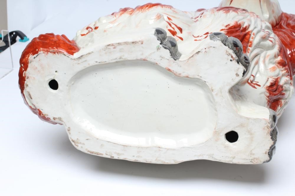 AN UNUSUALLY LARGE PAIR OF STAFFORDSHIRE STYLE POTTERY SPANIELS Image