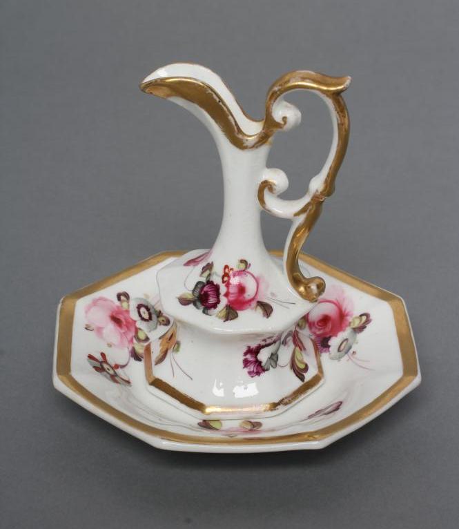 A ROCKINGHAM PORCELAIN MINIATURE EWER AND STAND Image