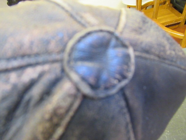 A GERMAN FIRST WORLD WAR LEATHER FLYING HELMET with small peak Image