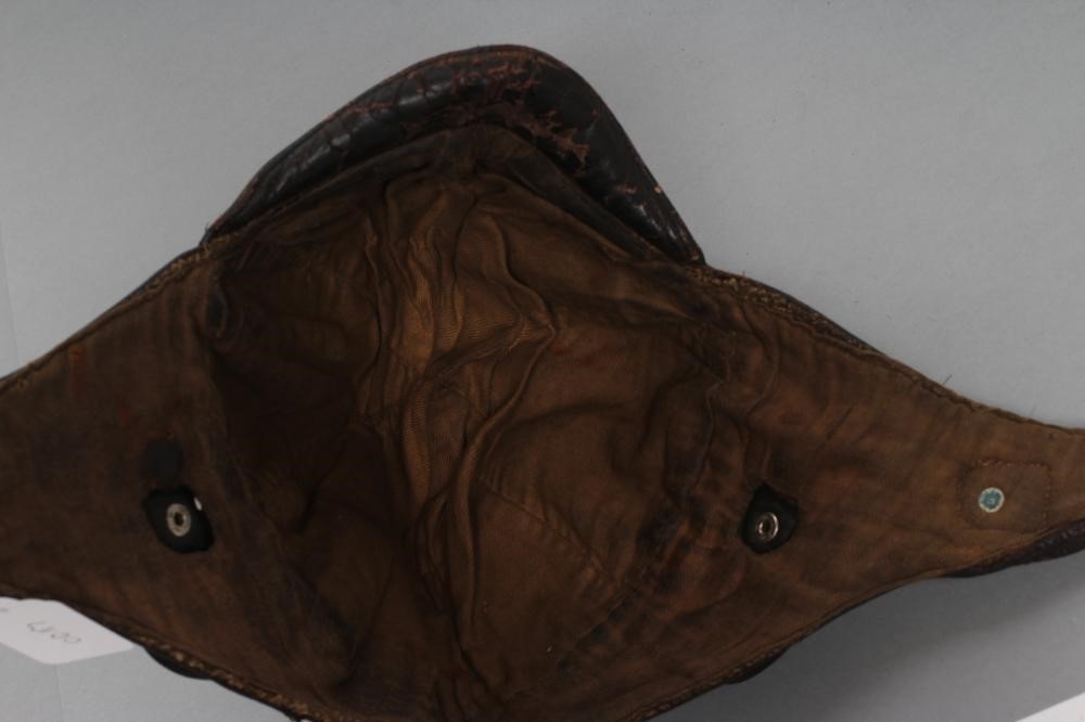 A GERMAN FIRST WORLD WAR LEATHER FLYING HELMET with small peak Image