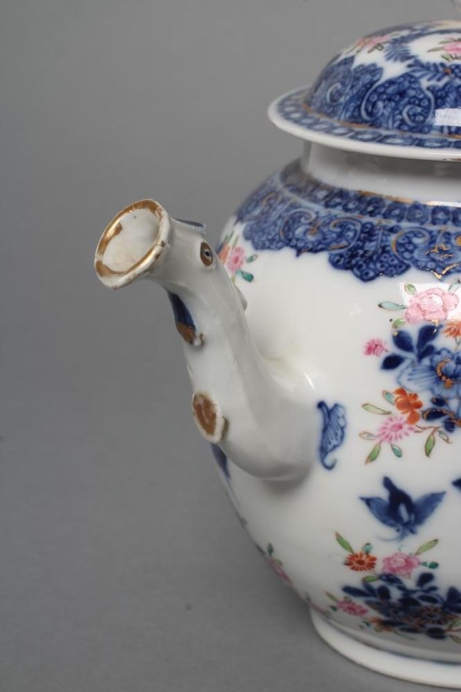 A CHINESE EXPORT PORCELAIN TEAPOT AND COVER of globular form with crabstock spout and later cane Image