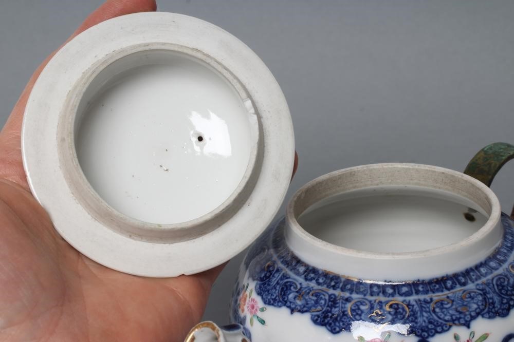 A CHINESE EXPORT PORCELAIN TEAPOT AND COVER of globular form with crabstock spout and later cane Image