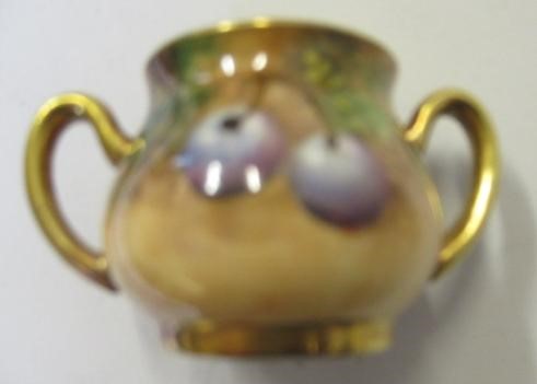 A ROYAL WORCESTER CHINA MINIATURE SOLITAIRE Image