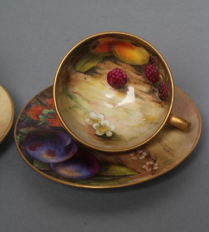A PAIR OF ROYAL WORCESTER CHINA SMALL CABINET CUPS AND SAUCERS Image