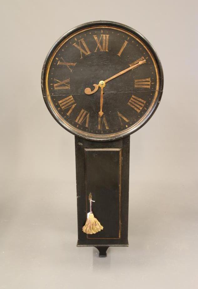 A BLACK LACQUERED TAVERN CLOCK Image