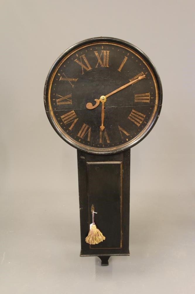 A BLACK LACQUERED TAVERN CLOCK Image