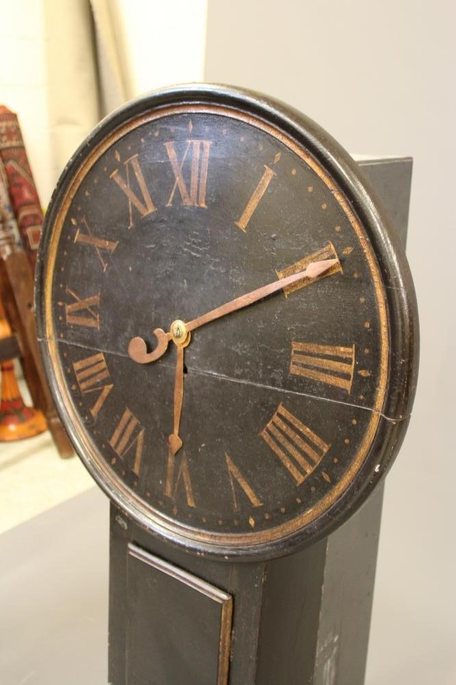 A BLACK LACQUERED TAVERN CLOCK Image