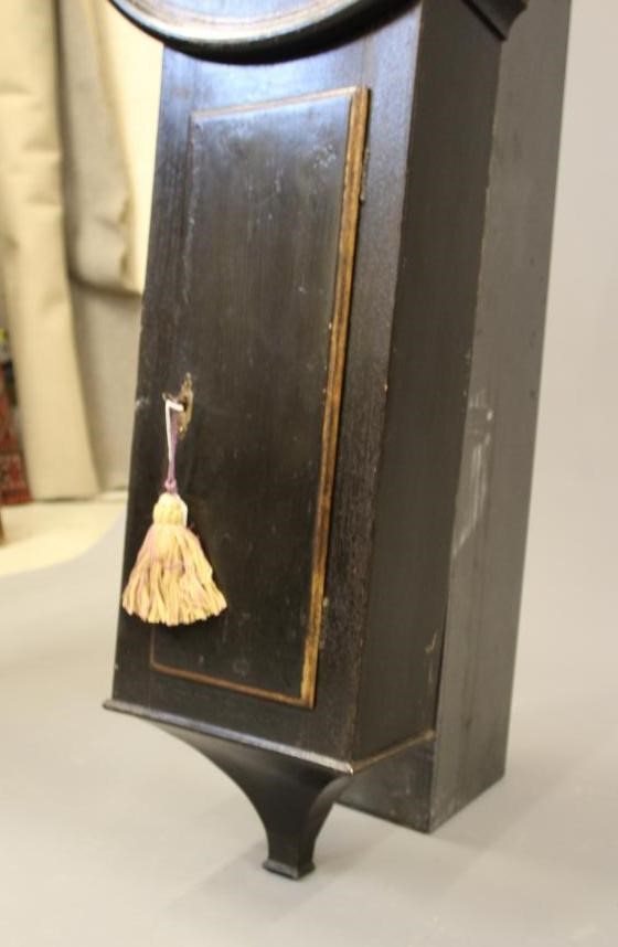 A BLACK LACQUERED TAVERN CLOCK Image