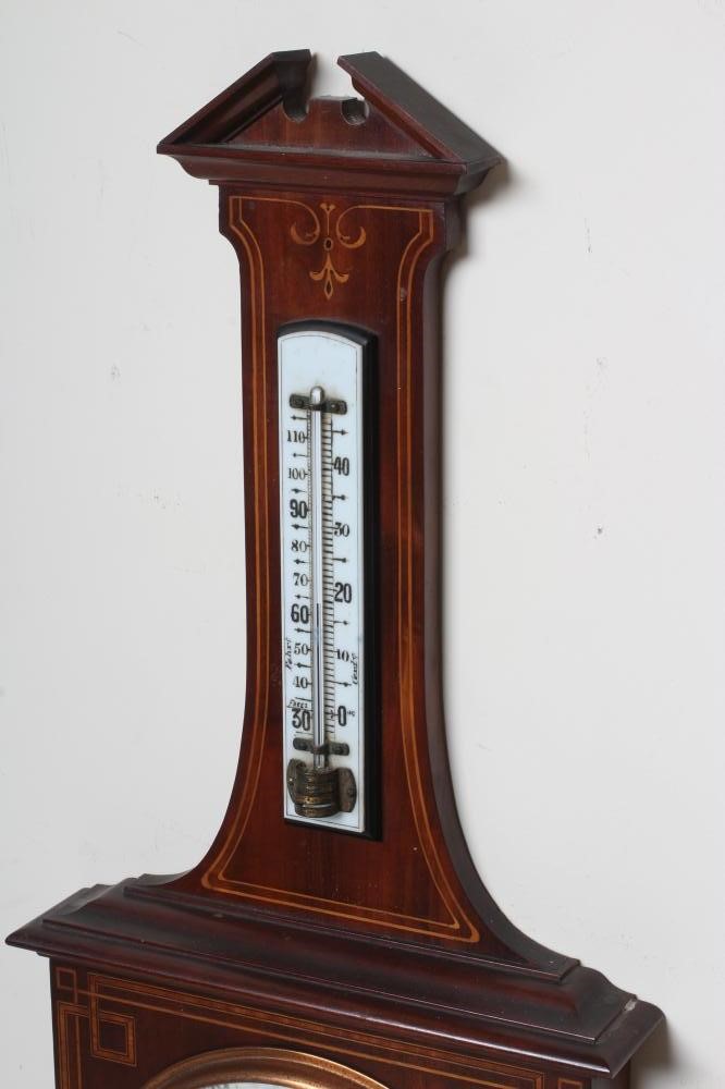 AN EDWARDIAN MAHOGANY ANEROID BAROMETER Image