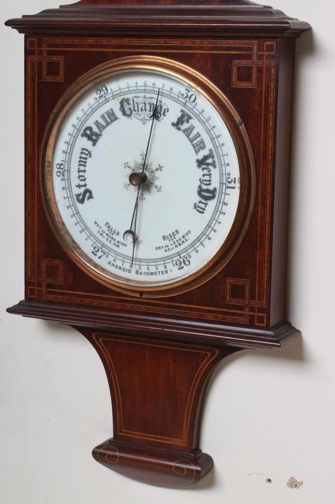 AN EDWARDIAN MAHOGANY ANEROID BAROMETER Image