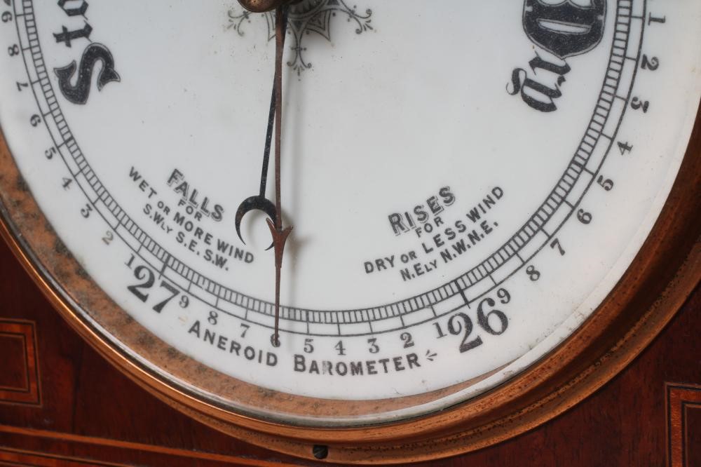 AN EDWARDIAN MAHOGANY ANEROID BAROMETER Image