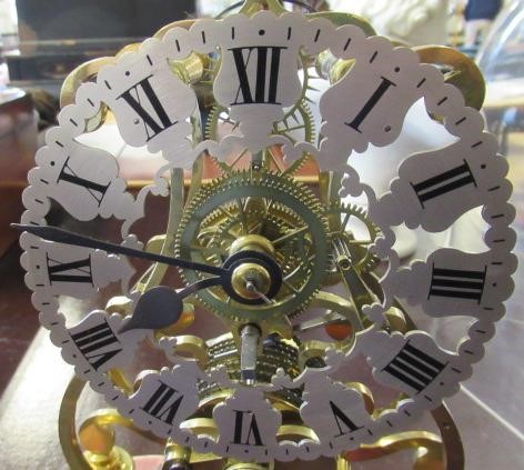 A BRASS SKELETON CLOCK Image
