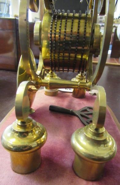 A BRASS SKELETON CLOCK Image