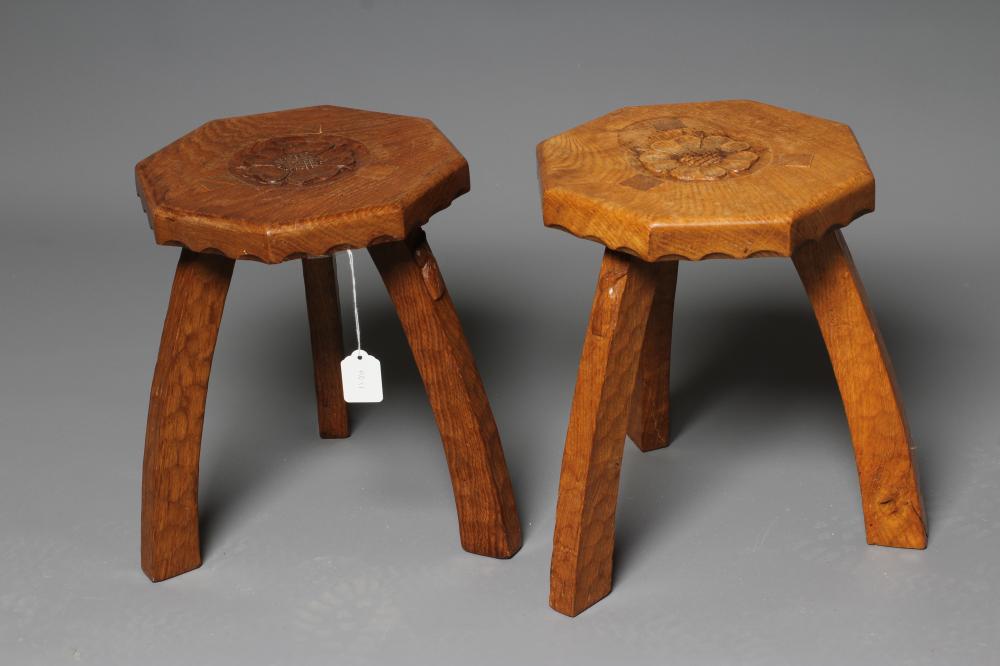 A PAIR OF HERBERT BIRD ADZED OAK THREE LEGGED STOOLS Image