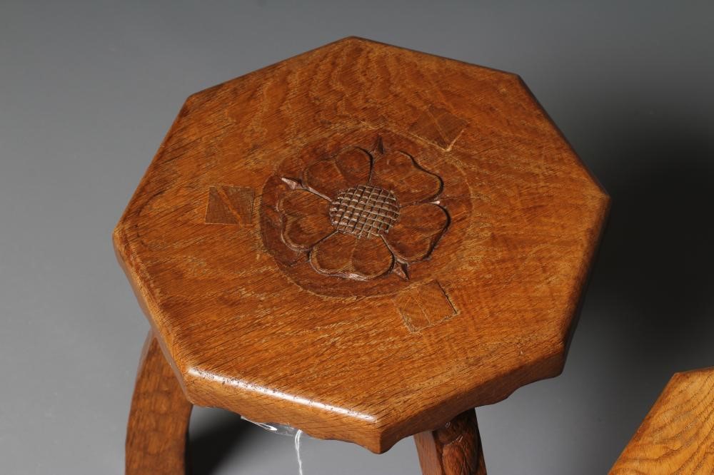 A PAIR OF HERBERT BIRD ADZED OAK THREE LEGGED STOOLS Image