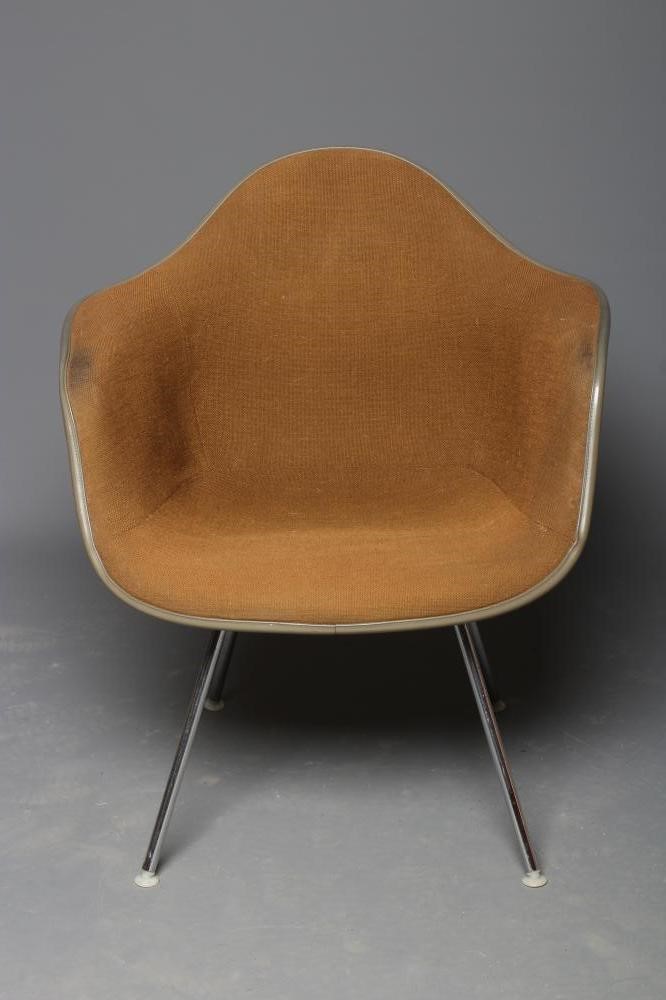 A CHARLES & RAY EAMES FOR HERMAN MILLER SHELL CHAIR in yellow fibre glass with brown woven cushion Image