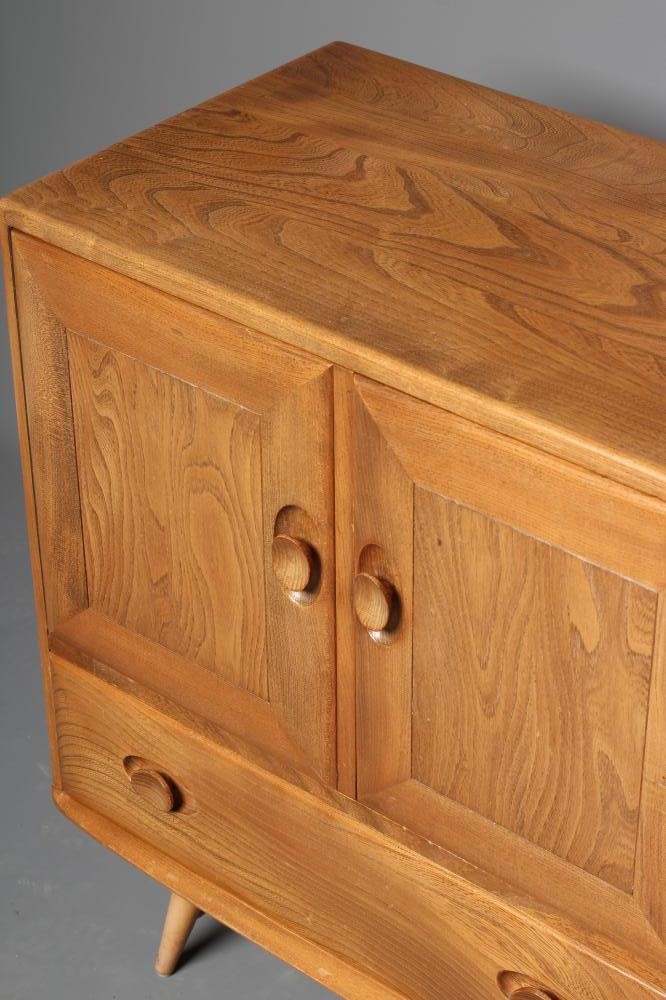 AN ERCOL LIGHT ELM SIDEBOARD Image