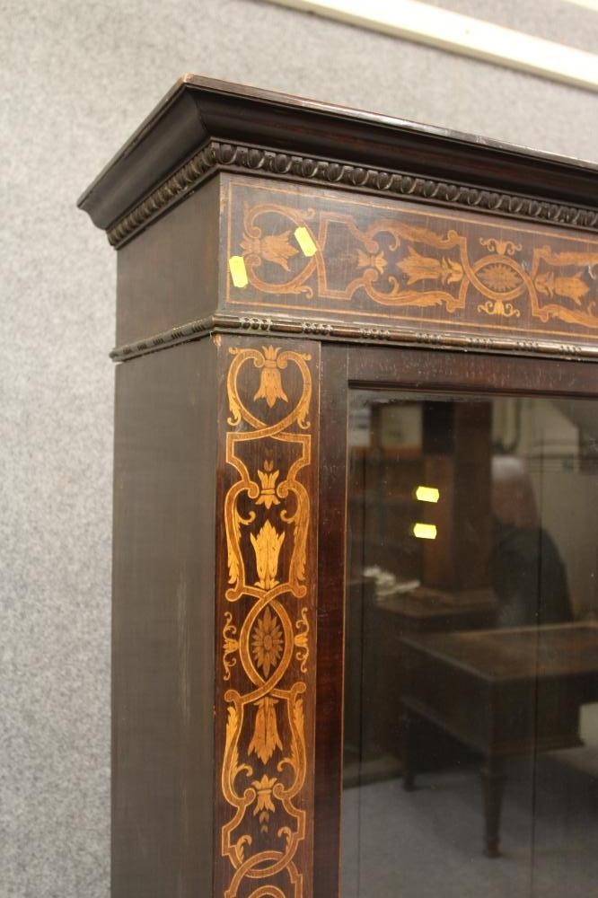 A DUTCH DARK STAINED MAHOGANY AND FOLIATE MARQUETRY BOOKCASE Image
