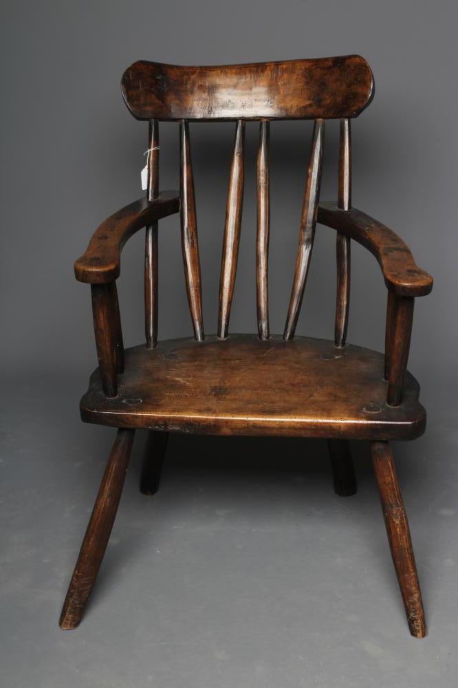 A PRIMITIVE STICK BACK WINDSOR ARMCHAIR Image
