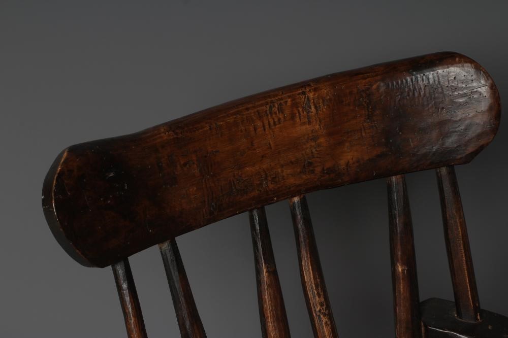 A PRIMITIVE STICK BACK WINDSOR ARMCHAIR Image