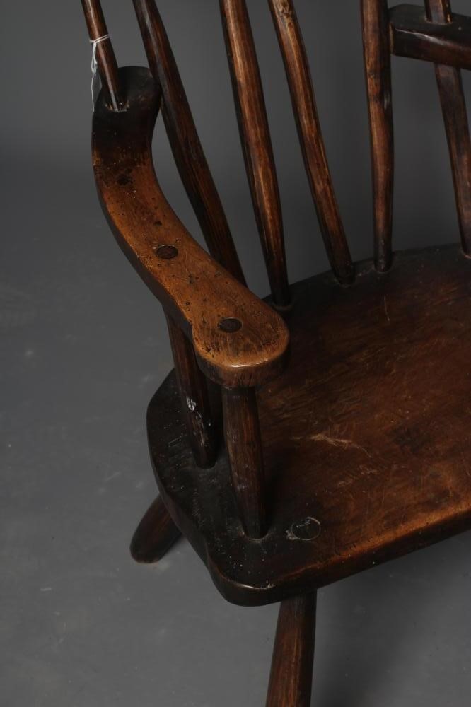 A PRIMITIVE STICK BACK WINDSOR ARMCHAIR Image