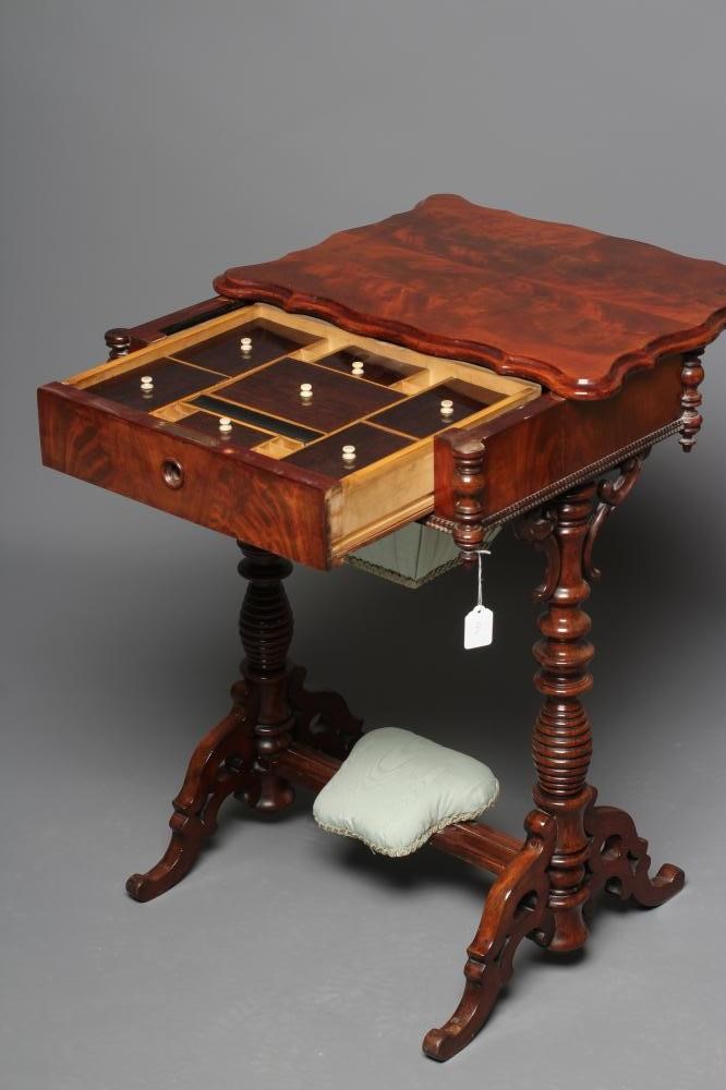 A VICTORIAN MAHOGANY WORK TABLE of serpentine oblong form with turned pendants Image