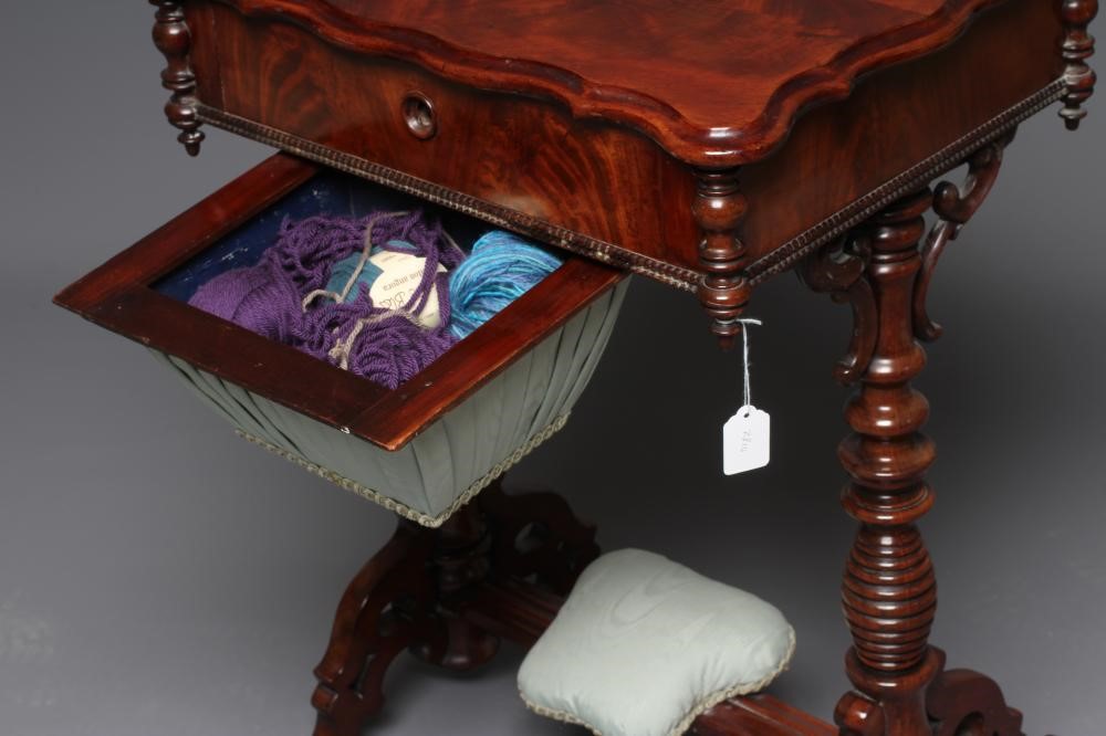 A VICTORIAN MAHOGANY WORK TABLE of serpentine oblong form with turned pendants Image