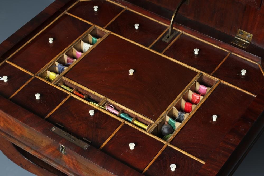 A WILLIAM IV MAHOGANY WORK TABLE of canted oblong form with cushion moulded frieze Image