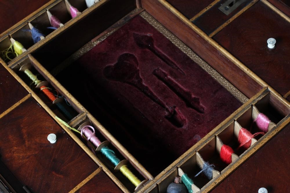 A WILLIAM IV MAHOGANY WORK TABLE of canted oblong form with cushion moulded frieze Image