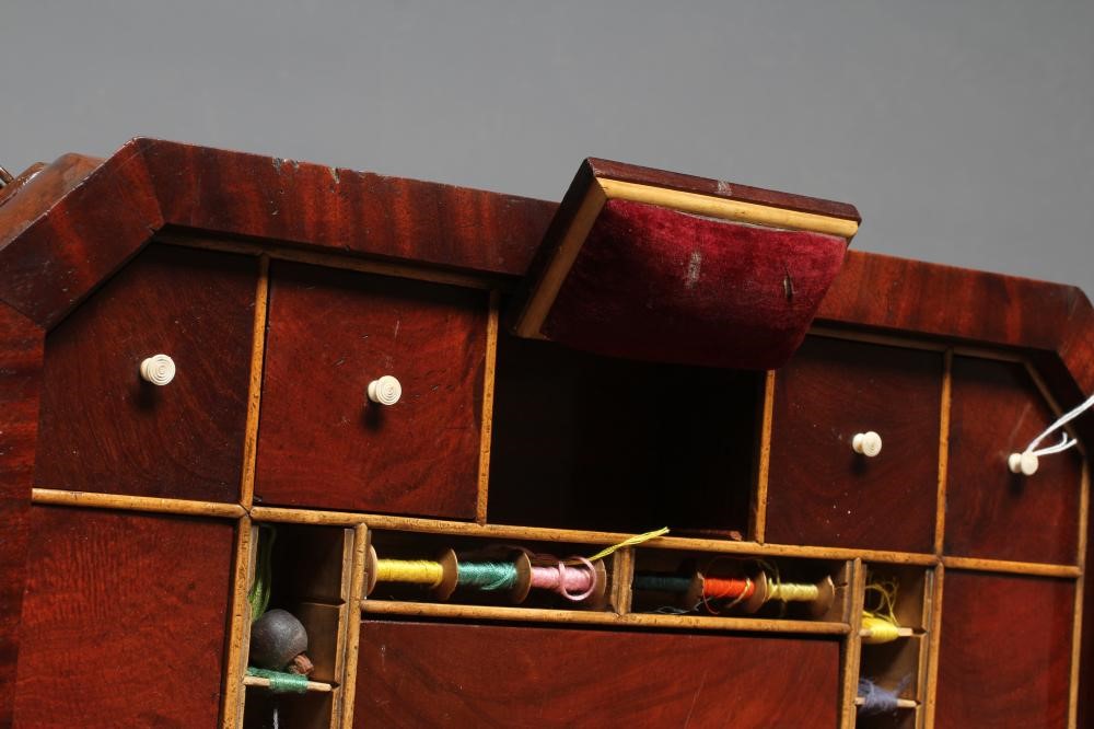A WILLIAM IV MAHOGANY WORK TABLE of canted oblong form with cushion moulded frieze Image