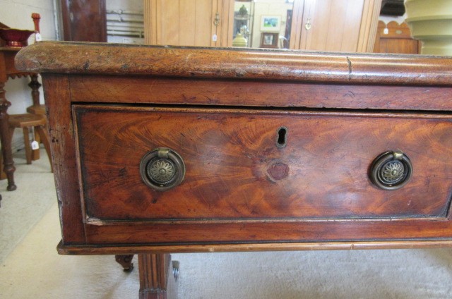 A REGENCY MAHOGANY LIBRARY TABLE Image