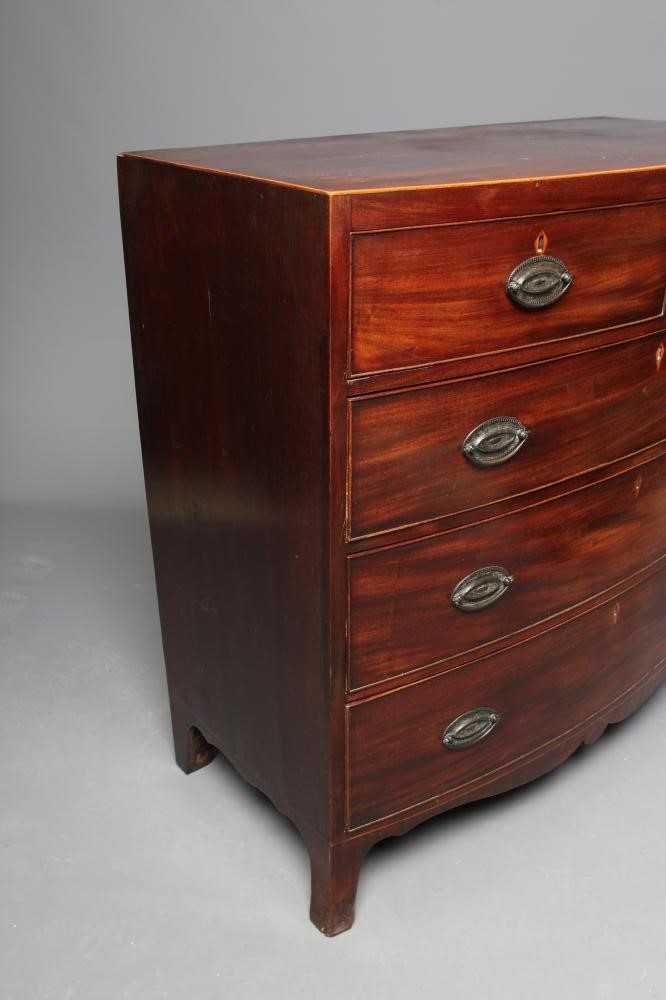 A REGENCY MAHOGANY BOWED CHEST of two short and three long cockbeaded drawers Image
