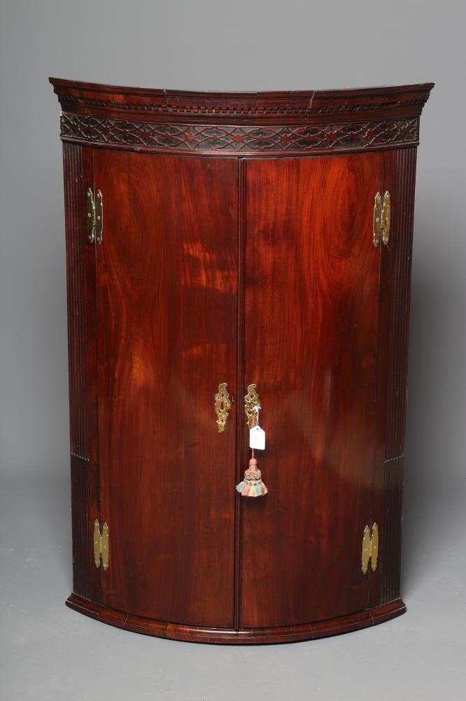 A GEORGIAN MAHOGANY BOWED CORNER CUPBOARD Image