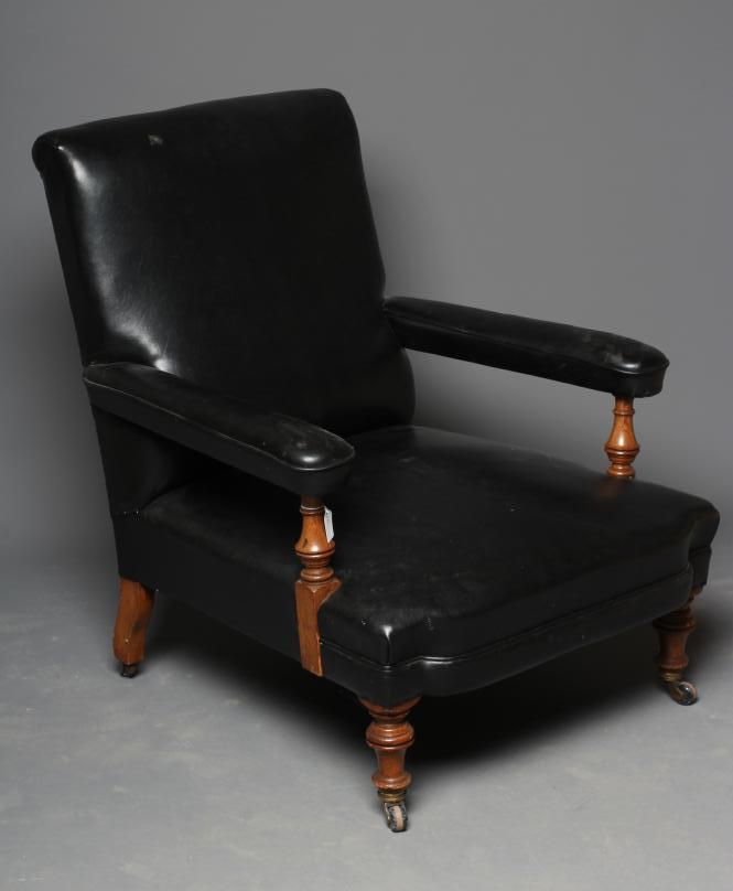A VICTORIAN GOLDEN OAK CLUB ARMCHAIR upholstered in black leatherette Image
